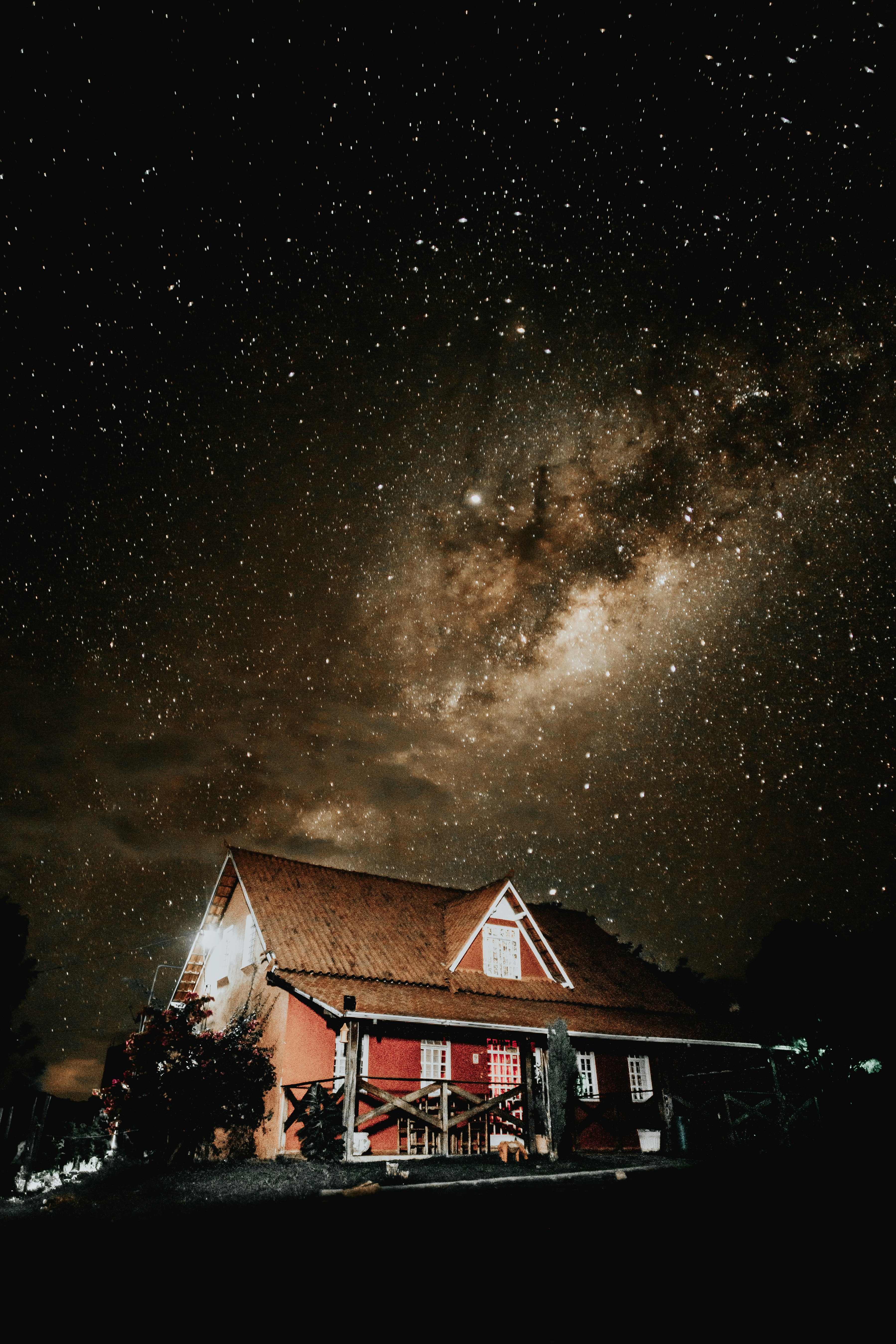 brown and red cottage at night